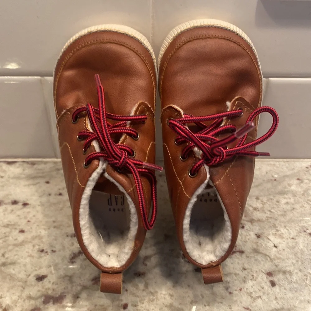 Baby Gap size 18-24 months brown bootie with Sherpa lining. Red laces.  Like new